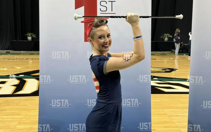 Lyndsie Acker poses after finishing first in both the national championship and world qualifier at the U.S. National Baton Twirling Championships in Fairborn, Ohio July 14. (Photo courtesy of Eden Acker)