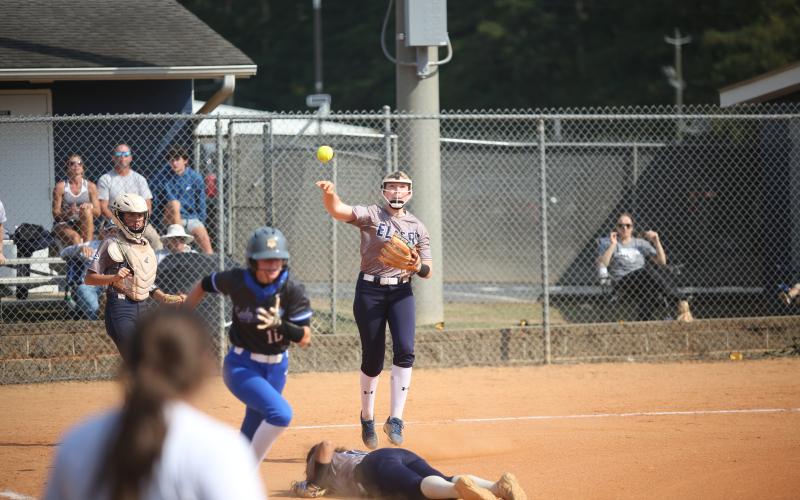 Audrey Lunsford leaps and throws over Ky Dubose during the 2023 season. Lunsford, Dubose and the Lady Devils softball team are scheduled to start their 2024 season with an away game against North Oconee Aug. 1. (File photo by Wells)