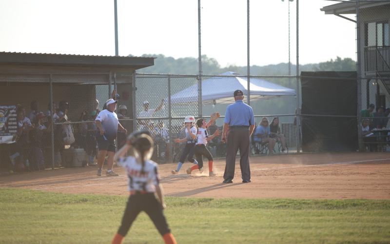 Jaycie Peacock beats the ball to first base as she records a single against Hart June 27. (Photo by Wells)