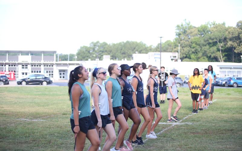 Twirlers (L-R) Audrey Poon, Sydney Prince, Chansley Brown, Journee Porter, Lake Chandler and Caraleigh Brown practice marching during band camp July 16. (Photo by Wells)