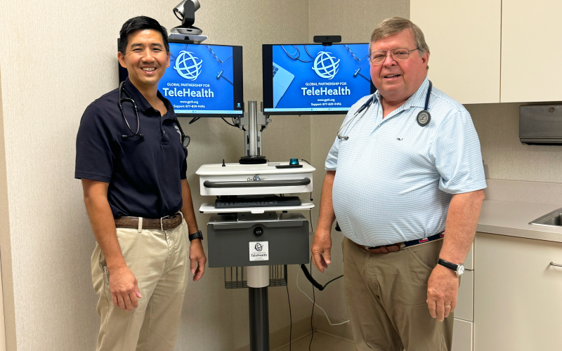 (Above L-R) Dr. Jonathan Poon and Dr. Dan McAvoy stand with the new telehealth cart provided to the Medical Center of Elberton as part of the KidsABC program.  (Photo by Weeks)