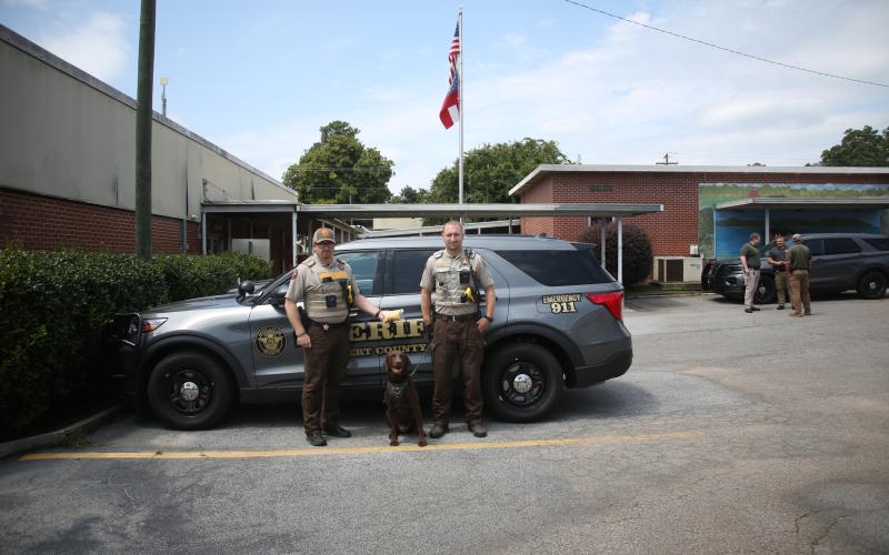 (Above L-R) Lieutenant Allen Frady, K-9 officer Remi and Sergeant Clete Brady display the methamphetamine recovered during a recent drug bust made by the Elbert County Sheriff's office. (Photo by Wells)