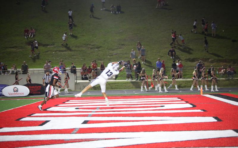No. 13 Brady Dickerson gets behind the Stephens defense and hauls in a touchdown pass. (Photo by Wells)