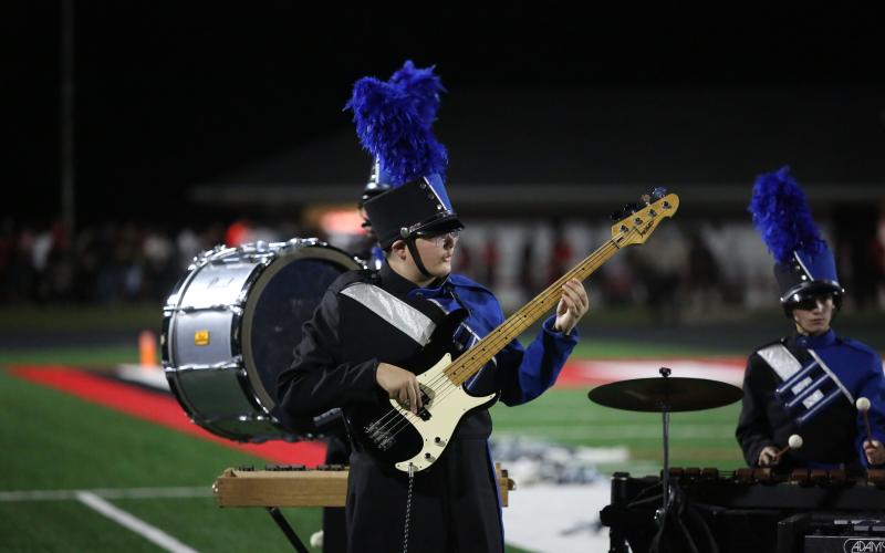 Brantley Stanley performs bass guitar during The Blue Devil Band’s halftime show. (Photo by Wells)