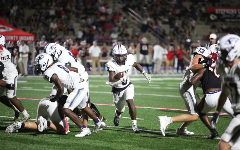 Jermaine Sims tucks behind his blockers and finds a hole on his way to the end zone. (Photo by Wells)