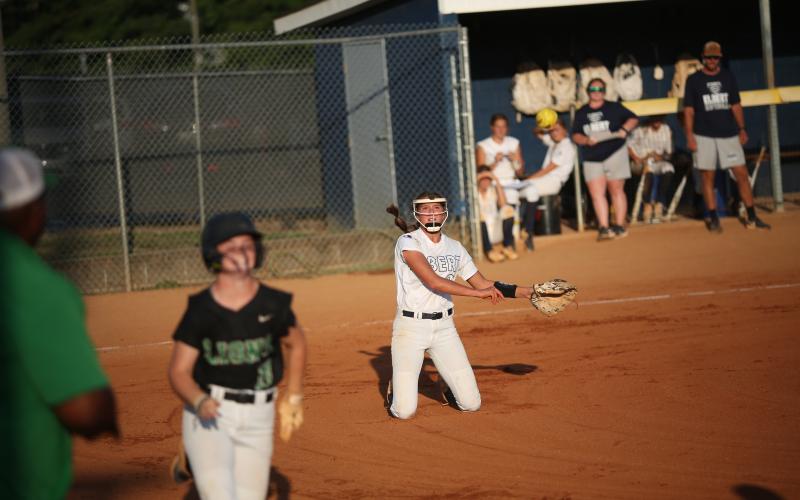 Kamryn Webb tries to beat the runner with a throw to first base. (Photo by Wells)