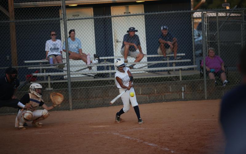Kimberly Hernandez hits the ball into the outfield to score a run. (Photo by Wells)