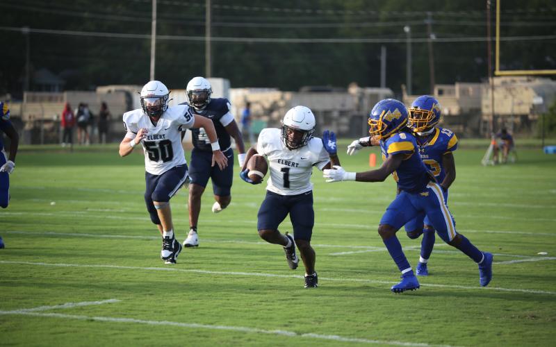 No. 1 Ty’Rikis Jones throws out a stiff arm during a long reception in the Aug. 2 scrimmage against Washington-Wilkes. (Photo by Wells)