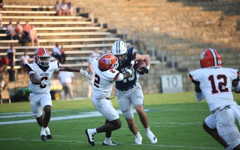 Brady Dickerson attempts to run through a Bulldog player after catching a pass. (Photo by Wells)