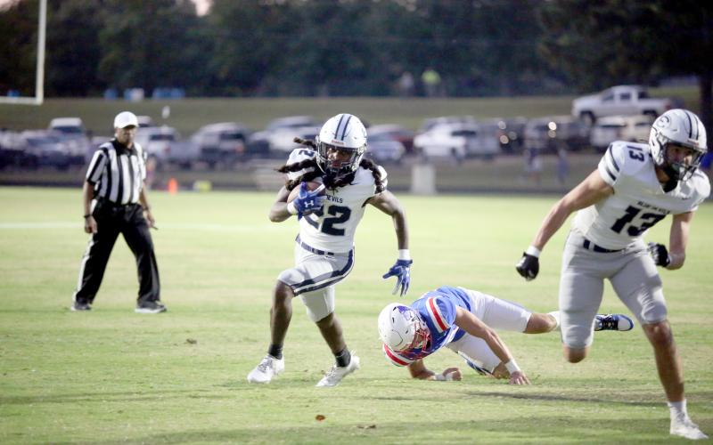 Elbert running back Jacari Barnett leaves an Oglethorpe defender in his wake as he rushes into the end zone for his first of three touchdowns. (Photo by Wells)