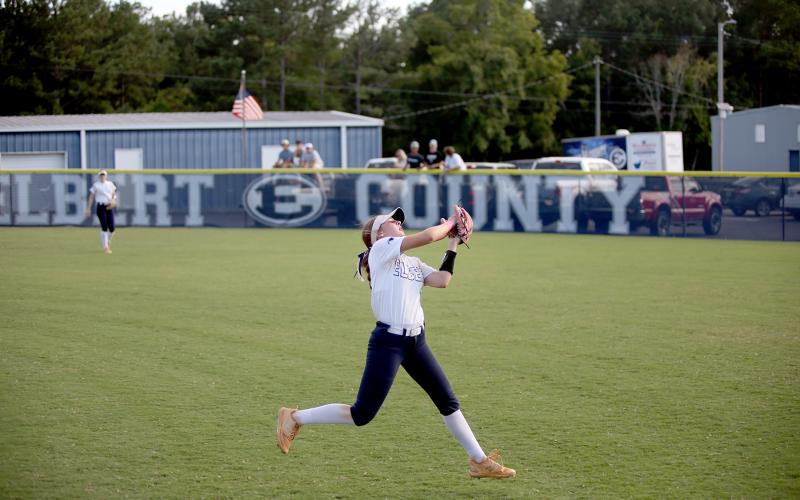 Hannah Brady makes a leaping catch in the outfield. (Photo by Wells)