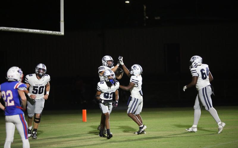 Brady Dickerson high fives Ty’Rikis Jones after catching a 39-yard touchdown pass. (Photo by Wells)