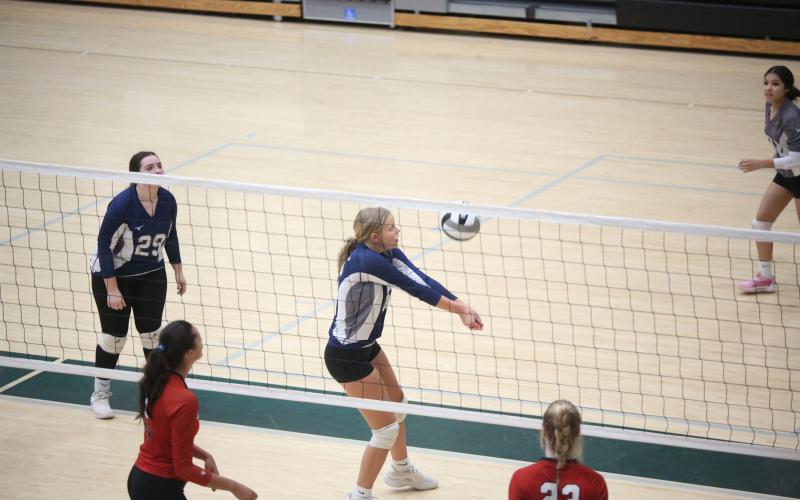 Cadence Noggle bumps the ball up to a teammate as the Lady Devils look to score a point against Loganville Aug. 29. (Photo by Wells)