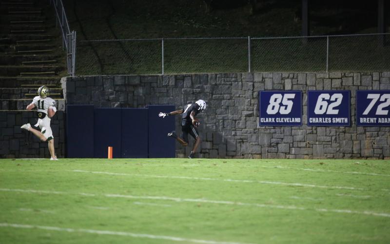 .K Winn leans over the goal line like a sprinter finishing a race after a 59-yard touchdown reception in the first quarter of Elbert’s win over Wesleyan. (Photo by Wells)