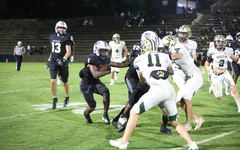 Ty’Rikis Jones follows his blockers on a rushing attempt during Elbert’s win over Wesleyan. (Photo by Wells)