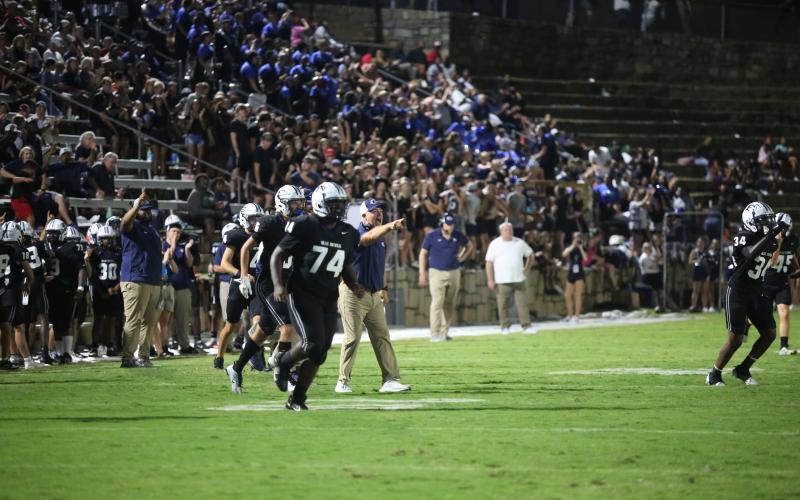 Offensive Coordinator Andy Dyer praises his offense after Ty’Rikis Jones scored a rushing touchdown against Wesleyan. (Photo by Wells)