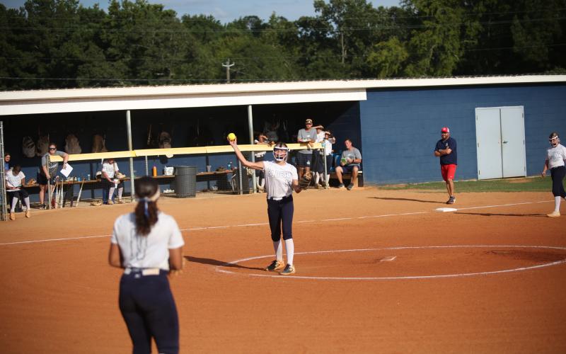 Ella Harris fields a hit and throws over to first to get the runner out. (Photo by Wells)