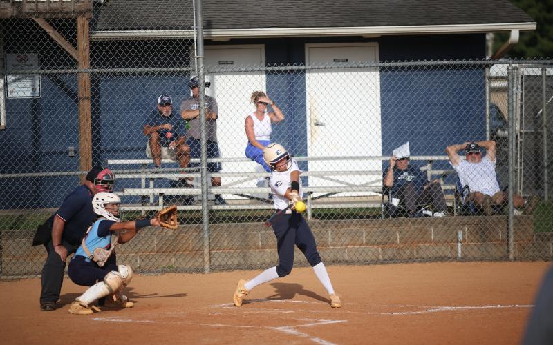 Kamryn Webb makes contact with the ball during the win over Providence Christian. (Photo by Wells)