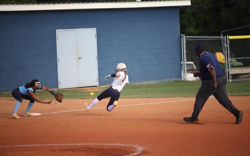 Miller Drake goes sliding into third base after hitting a triple against Providence Christian Sept. 5. (Photo by Wells)