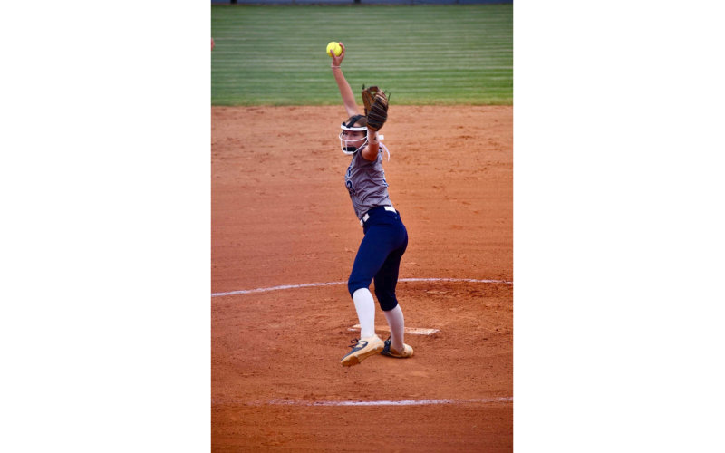 Ella Harris lets a pitch fly during Elbert’s Sept. 16 game against Madison County. (Photo by Bethany Booth - Elbert County True Blue)