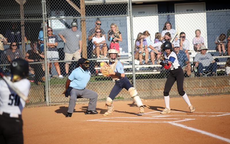 Reagan Baker pops up and looks to first after fielding a pitch during the game against Barrow Arts and Sciences Academy. (Photo by Mark Wells)