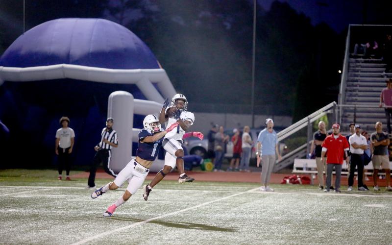 Ty’Rikis Jones makes a leaping grab in front of a Providence Christian defender during Elbert’s 48-6 victory over the Storm. (Photo by Mark Wells)