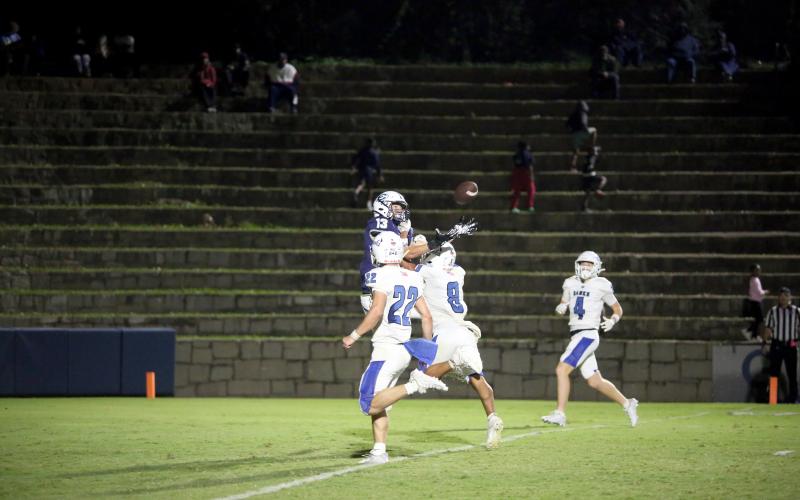 Brady Dickerson makes a contested catch in double coverage during Elbert’s homecoming win over Banks County Oct. 11. (Photo by Wells)