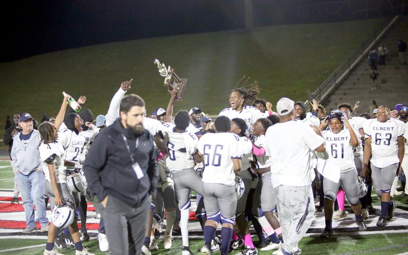 The Elbert County Middle School Rams celebrate after receiving the NEGIAA Championship trophy from the Stephens County Athletic Director. (Photo by Wells)