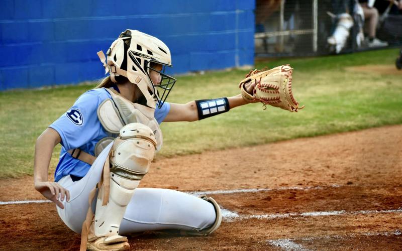 Lady Devil catcher Reagan Baker frames a pitch in Elbert County’s series against Bremen Oct. 24. (Photo by Bethany Booth - Elbert County True Blue)