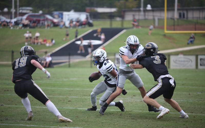 Antonio Brown follows lead blocker Carter Webb during Elbert’s loss against Commerce Sept. 28. (Photo by Wells)