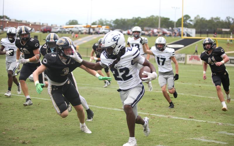 Jacari Barnett stiff arms a Commerce defender during Elbert County’s 42-27 loss to Commerce Sept. 28. Barnett led the team in rushing yards after gaining 130 yards on 20 carries. (Photo by Wells)