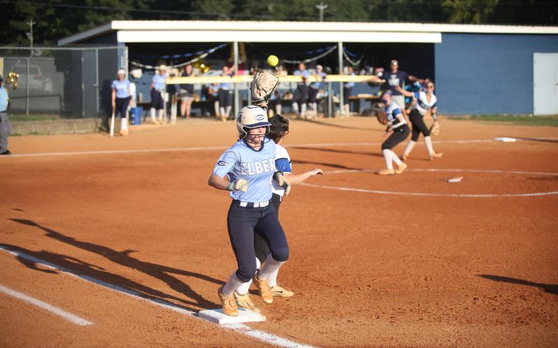 Hannah Brady beats the throw at first base after putting the ball in play. (Photo by Mark Wells)