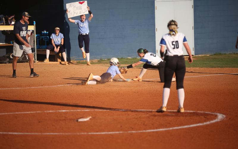 Miller Drake slides into third base after stealing a bag during Elbert’s 17-0 win over Barrow Arts and Sciences Academy Oct. 3. (Photo by Mark Wells)