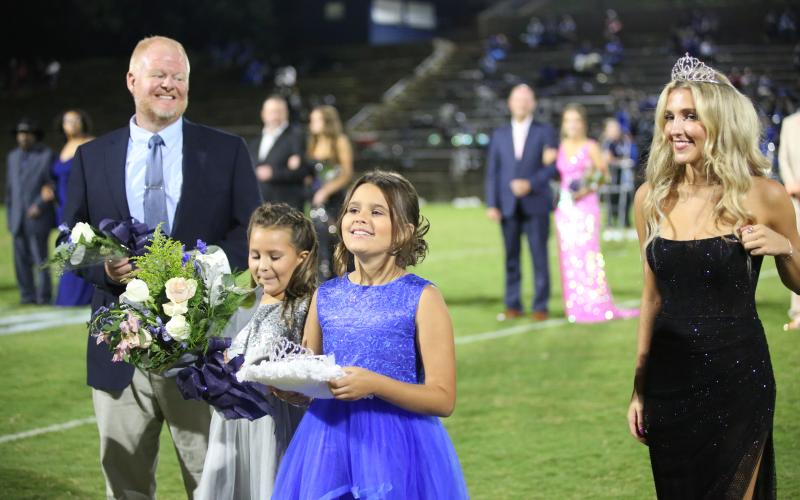 ECCHS principal Josh Rider, Tess and Vada Walker and the 2023 ECCHS Homecoming Queen Gracie Brady prepare for the announcement. (Photo by Wells)