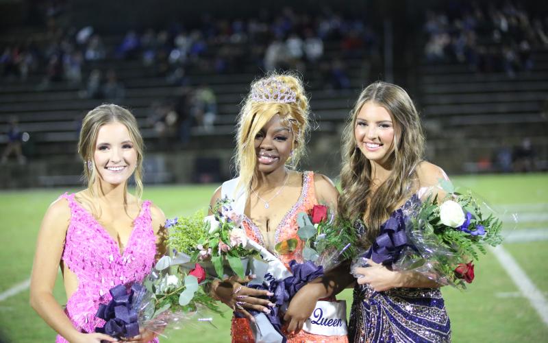 Second runner-up Victoria Jarvis, 2024 Homecoming Queen Heaven Robinson and first runner-up Hannah Brady pose after Robinson was crowned. (Photo by Wells)