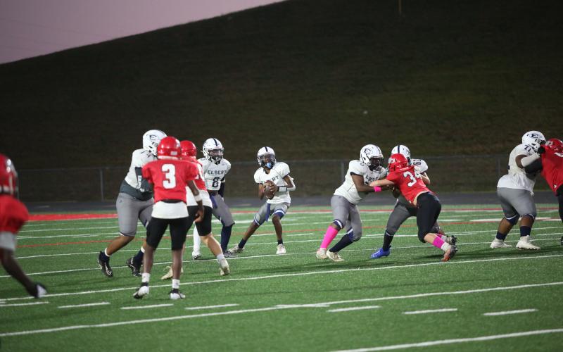 Tavarris Willis drops back to pass during the win over Stephens. (Photo by Wells)