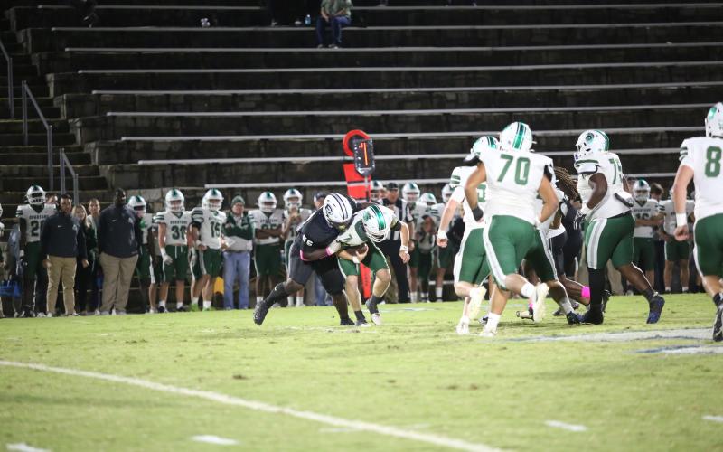 Jerrell Sims sacks the Athens Academy quarterback. (Photo by Wells)
