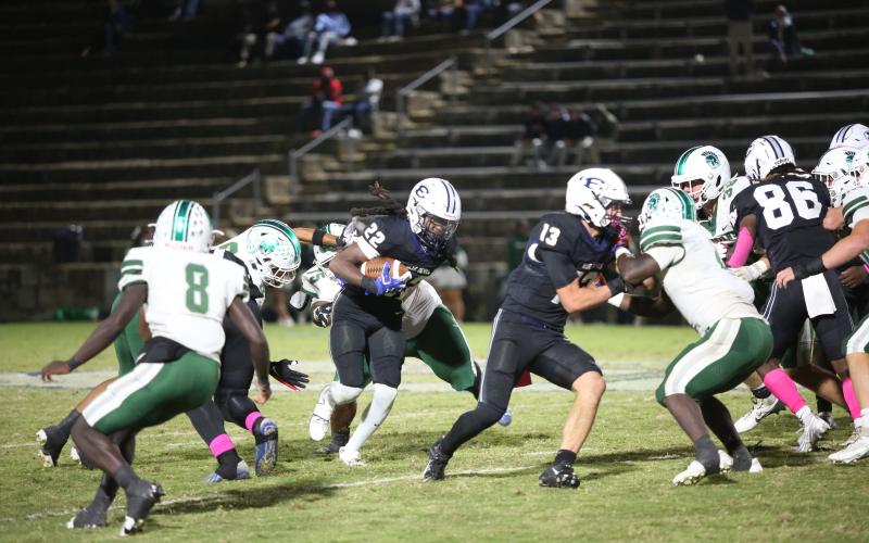 No. 22 Jacari Barnett follows lead blocker No. 13 Brady Dickerson during Elbert’s loss to Athens Academy Oct. 18. Barnett finished with 179-yards rushing and three touchdowns on 31 carries. (Photo by Wells)
