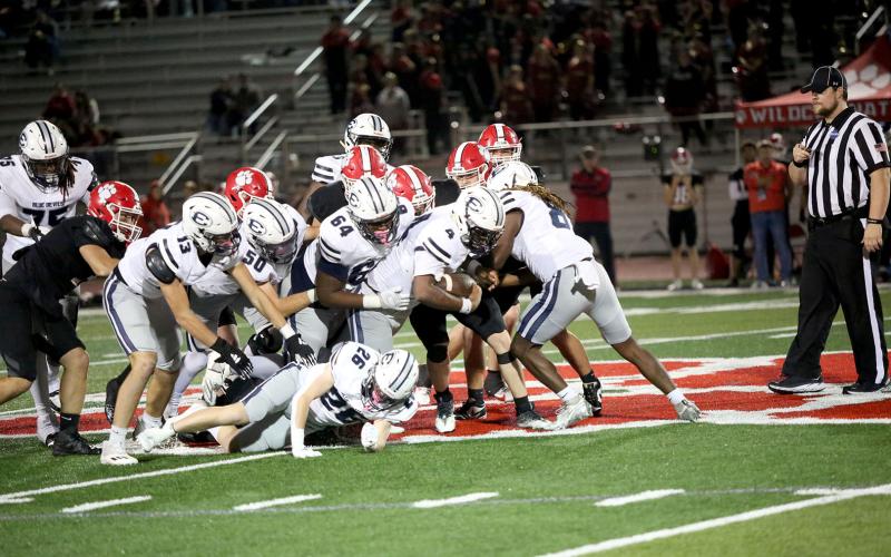 No. 4 Jayvyn Hickman gets a push from No. 13 Brady Dickerson, No. 50 Landon Williams, No. 64 Camron Ardister, No. 26 Colson Brown and No. 8 Marion Rambert to convert on fourth down during Elbert County’s win over Rabun County Nov. 1.  (Photo by Bethany Booth - Elbert County True Blue)