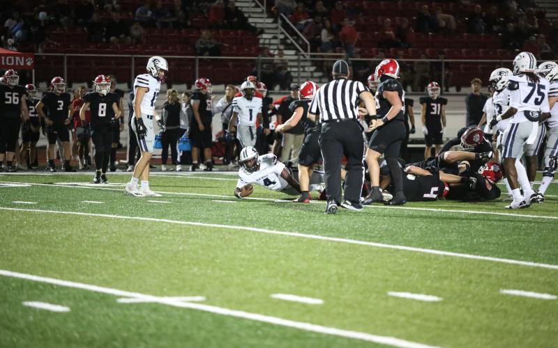 Jayvyn Hickman dives forwards for extra yards during Elbert’s win over Rabun County. (Photo by Bethany Booth - Elbert County True Blue)