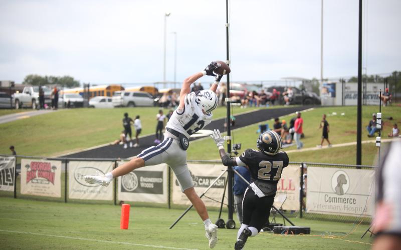 No. 13 Brady Dickerson makes a leaping touchdown catch during Elbert County’s game against Commerce Sept. 28. Commerce joins Elbert’s quadrant of the GHSA State Playoff Bracket. (File photo by Wells)