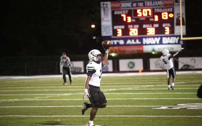 Sims runs off the field after recovering the fumble forced by Fortson. (Photo by Wells)