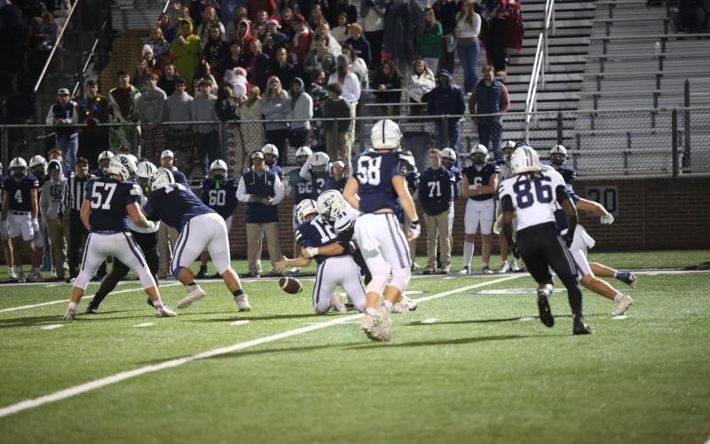 Lincoln Blackmon forces a fumble while sacking the Gordon Lee quarterback. (Photo by Wells)