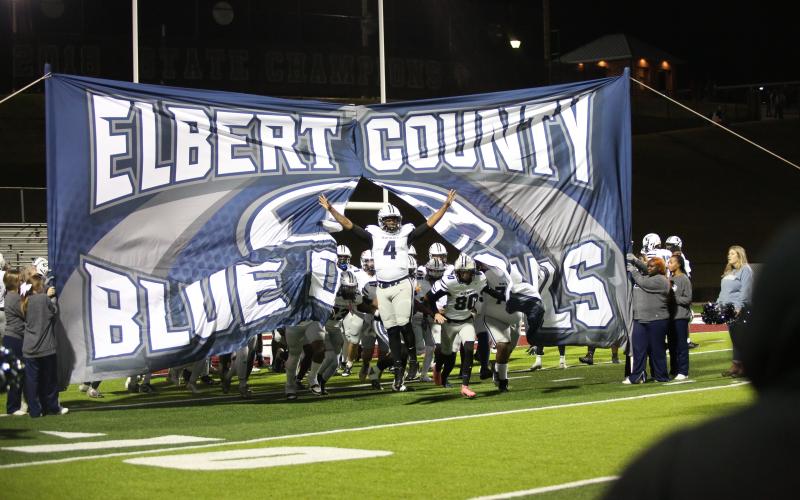 Senior Jayven Hickman leads the team onto the field at the beginning of the playoff game against Heard County High School in Franklin Friday, Nov. 22. The Blue Devils bested the Braves 26-24, qualifying them as one of the "Elite Eight" in the Class A Division 1 State Tournament. The Devils will face the Toombs County Bulldogs Friday in Lyons. Check the ECCHS Athletics website to comfirm the start time. (File photo by Wells)