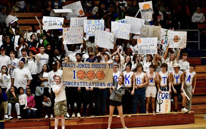 The Elbert County student section goes wild with signs and cheers after Grady Jones hit a contested three-point shot to hit 1,000 career points. (Photo courtesy of Elbert County True Blue)