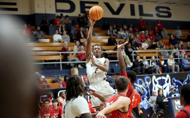 Jordon Morrison rises and attempts a floater during Elbert’s loss to Madison County Dec. 7. (Photo by Wells)