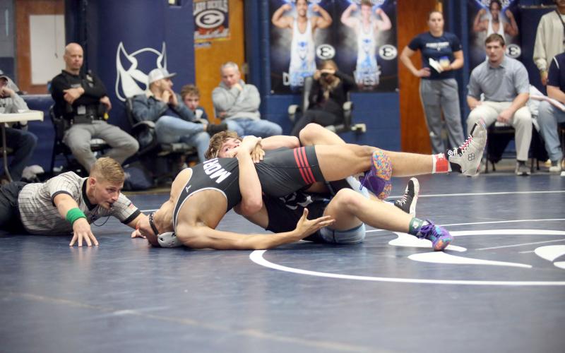 Brycin Hughes tries to get his opponents shoulders flat on the ground as he looks for a pin during the Granite City Duals hosted by Elbert County in the Inferno Dec. 21. Hughes later finished off the pin and finished 3-2 overall on the day. (Photo by Wells)