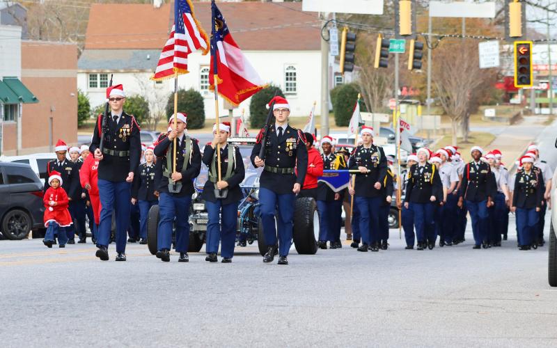 The ECCHS Color Guard led the parade ahead of Jaukeem Fortson and the ECCHS ROTC. (Photo by Weeks)