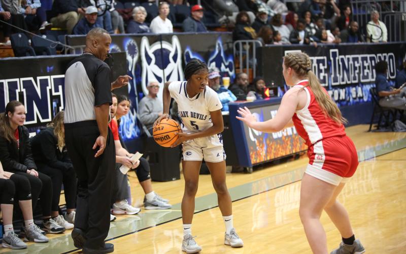 Aaliyah Allen sizes up her defender before driving to the basket during Elbert’s win over Madison County. (Photo by Wells)