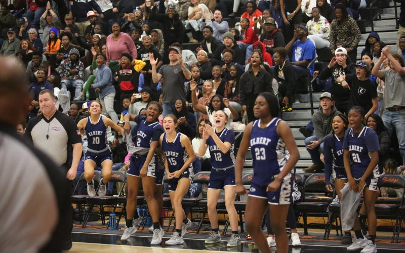 The Lady Devils bench celebrates a point while No. 23 Zy Belcher flexes. Belcher and the Lady Devils are 3-0 on the season after Elbert dominated Washington-Wilkes in the Inferno Nov. 30. (File photo by Wells)